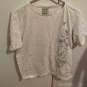 Sports wear company, woman’s size medium, white with flowers on side